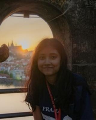 Photo of Usraat Fahmidah with sunset in the background